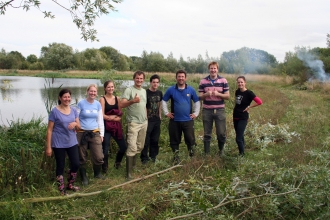 Happy volunteers from BGL Group help to remove willow from Irthlingborough in Sept 2013