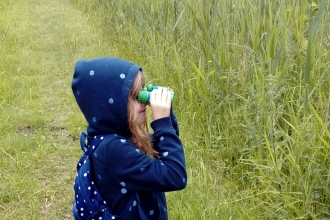 Emma takes a closer look at Woodwalton Fen through her binoculars