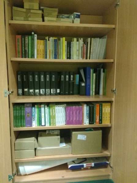 The WILDside resources cupboard, full of books and equipment