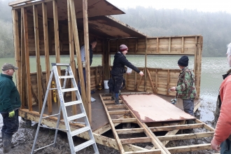 People help to construct the Savages Hide at Grafham Water