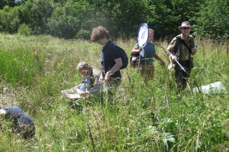 Expert recorders and young naturalists conducting a bioblitz in Fineshade