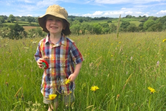 Bryn playing in a meadow