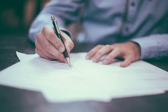 Man writing on paper