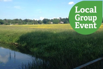 Portholme Meadow on a sunny day. Local Group Event icon overlaid.