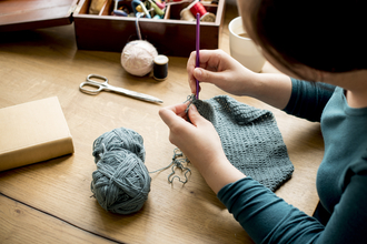 Person crocheting 