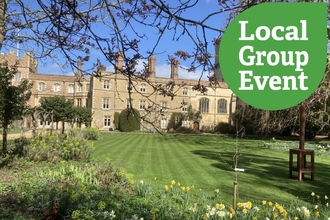 Jesus College Grounds in the sun, with local group event icon overlaid