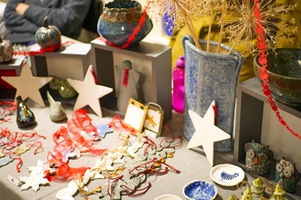 A variety of pots and festive decorations on a table