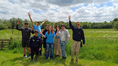 Young People's Forum members standing in the garden at Strawberry Hill