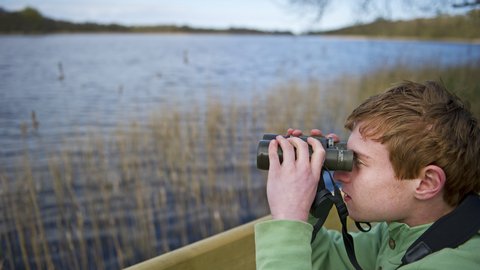 child with binoculars David Tipling/2020VISION 